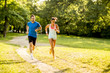 © BGStock72 - Young couple running in the park on a sunny day