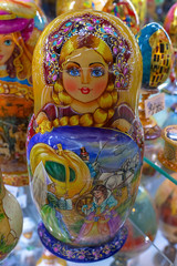 Wall Mural - Souvenir dolls on the shelf for sale. Russian Matryoshka Nesting Dolls Set in Classic Clothes at Gift Shop Shelf.  Souvenir from Russia.