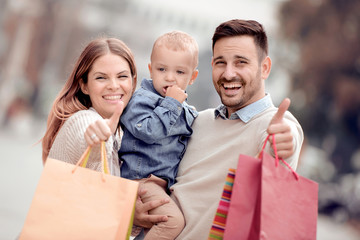 Wall Mural - Happy family with shopping bags