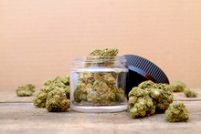 Marijuana In Open Jar Surrounded By Buds - Centered (Green Crack, Sativa Dominant Hybrid Straint) 