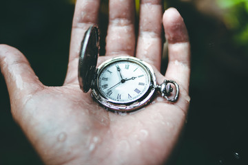 time Old silver pocket watch clock in hand