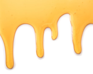 Wall Mural - Dripping honey isolated on white background