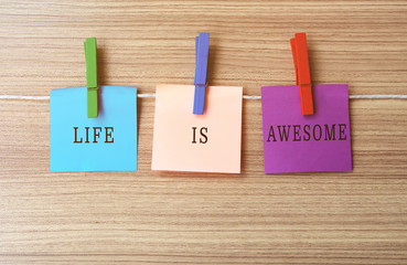 Wall Mural - Life is awesome Inspirational quote on notes hanging by clothespins