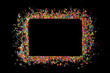 © sirintra - Border frame of colorful sprinkles on a black background with copy space. Top view or flat lay. Concept design for banner, poster and card