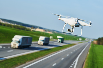 Wall Mural - drone and transportation. drone with camera controls highway road conditions