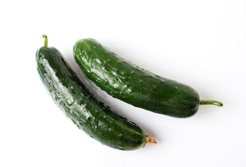 Freshly washed cucumbers on a wooden table