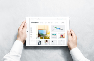 Wall Mural - hands holding tablet with electronic webstore mock up on screen, isolated. phones web page interface