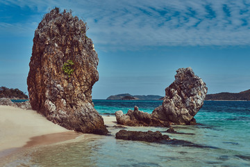 Wall Mural - Beautiful landscape rocky stalactite reefs on the shore of Philippine Islands.