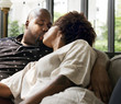 © Rawpixel.com - Black couple kissing on the couch