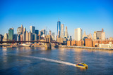 Fototapeta Nowy Jork - Brooklyn bridge and Manhattan at sunny day, New York City