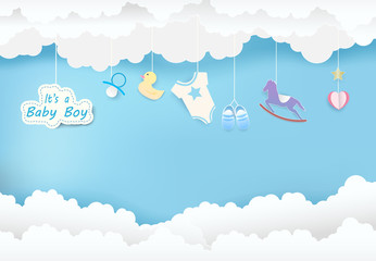paper art of cloud with toy shower on blue sky paper cut style, baby boy card illustration