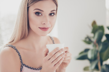 Poster - Close up portrait of confident, successful, charming, pretty, stylish, modern girl  having cup of coffee in arm enjoying morning time looking at camera