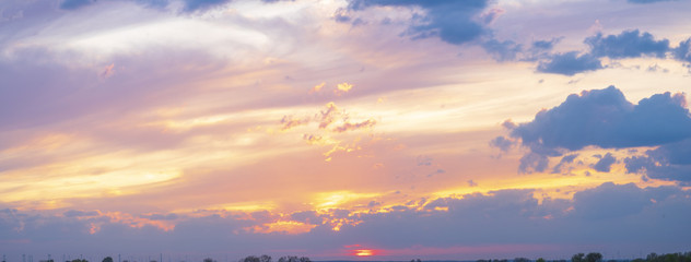 Wall Mural - fiery sunset, colorful clouds in the sky