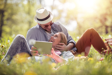 Poster - Happy couple in love having fun and enjoying the beautiful day in sunny park