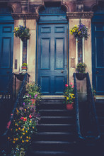 Glasgow Tenement Front Door And Stairs With Spring Flower Pots
