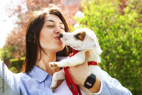 Beautiful Young Woman Takes Selfie Of Her Kissing Cute Jack