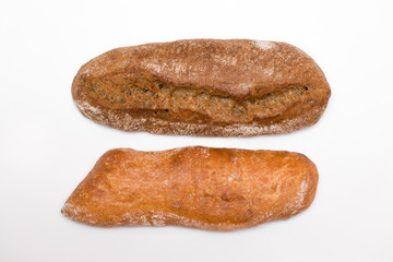 a loaf of black and white bread isolated on white background