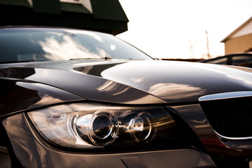 Wall Mural - luxury blue car front view. sunlight