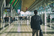 © Prasit Rodphan - Close up of businessman carrying suitcase while walking through a passenger departure terminal in airport. Businessman traveler journey business travel.