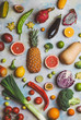 © LIGHTFIELD STUDIOS - top view of different fruits and vegetables on marble table
