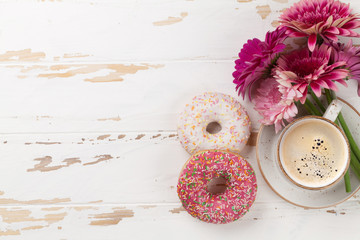 Canvas Print - Coffee cup, donuts and gerbera flowers