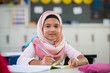 © Rido - Young girl in hijab at school