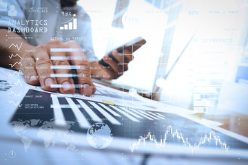 Poster - business documents on office table with smart phone and digital tablet and graph business diagram and man working in the background