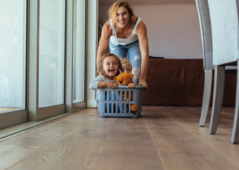 children enjoying at home with mother