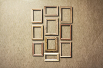 old photo frames on retro wallpaper