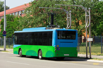 Sticker - Electric bus at a stop is charged by pantograph