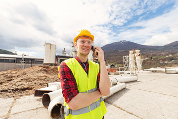 Wall Mural - Construction worker talking on the phone