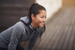 © Flamingo Images - Young Asian woman in sportswear preparing to go jogging