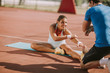 © BGStock72 - Woman training with personal trainer