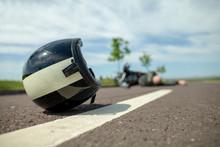 Biker Helmet Lies On Street Near A Motorcycle Accident