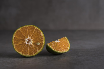 Wall Mural - Fresh orange fruits and juice on stone table.