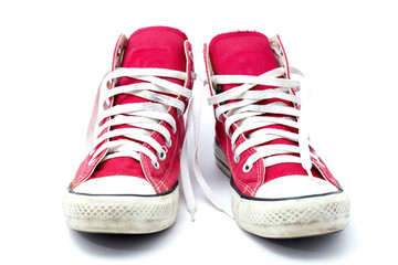 Old red sneaker on white background