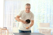 © Africa Studio - Senior man playing table tennis indoors