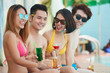 © DragonImages - Young people by the pool