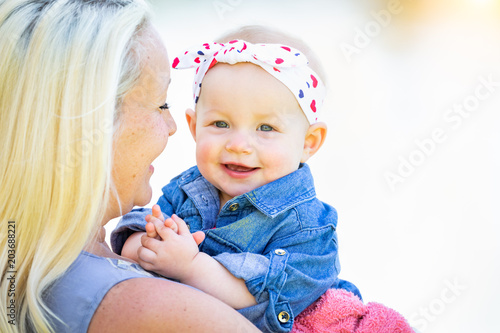 Fotografie, Obraz Young Caucasian Mother and Daughter At The Park