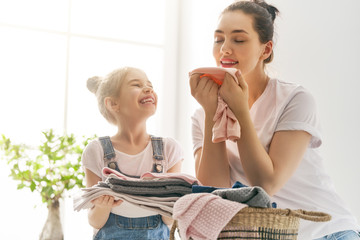 Wall Mural - family doing laundry at home