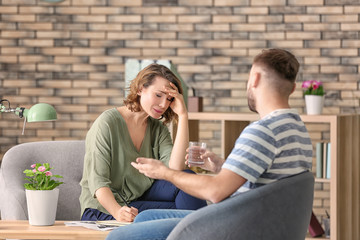 Female psychologist working with patient in office