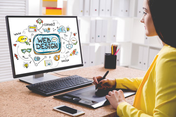 Woman designer drawing a web design sketch