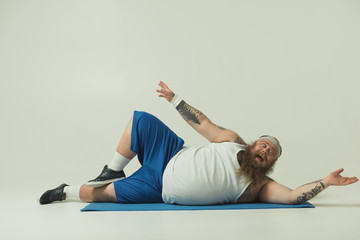 Man exercising on a yoga mat