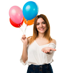 Canvas Print - Beautiful young girl holding a balloon and holding something