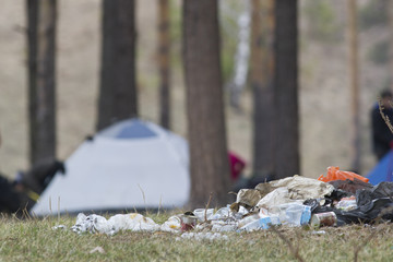 trash and garbage in forest camping
