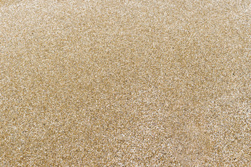 Closeup of sand texture pattern of a beach in the summer