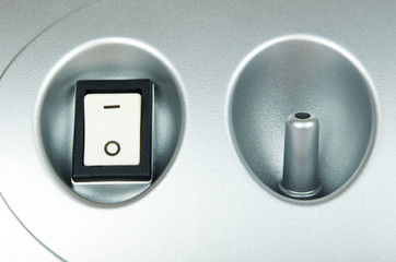 White power switch button on grey device