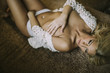 © BGStock72 - Pretty young woman laying on the bed