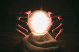Fototapeta  - Crystal ball and fortune teller hands. Divination concept. The spiritual seance. Future reading.