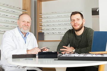 Wall Mural - Patient choosing eye glasses